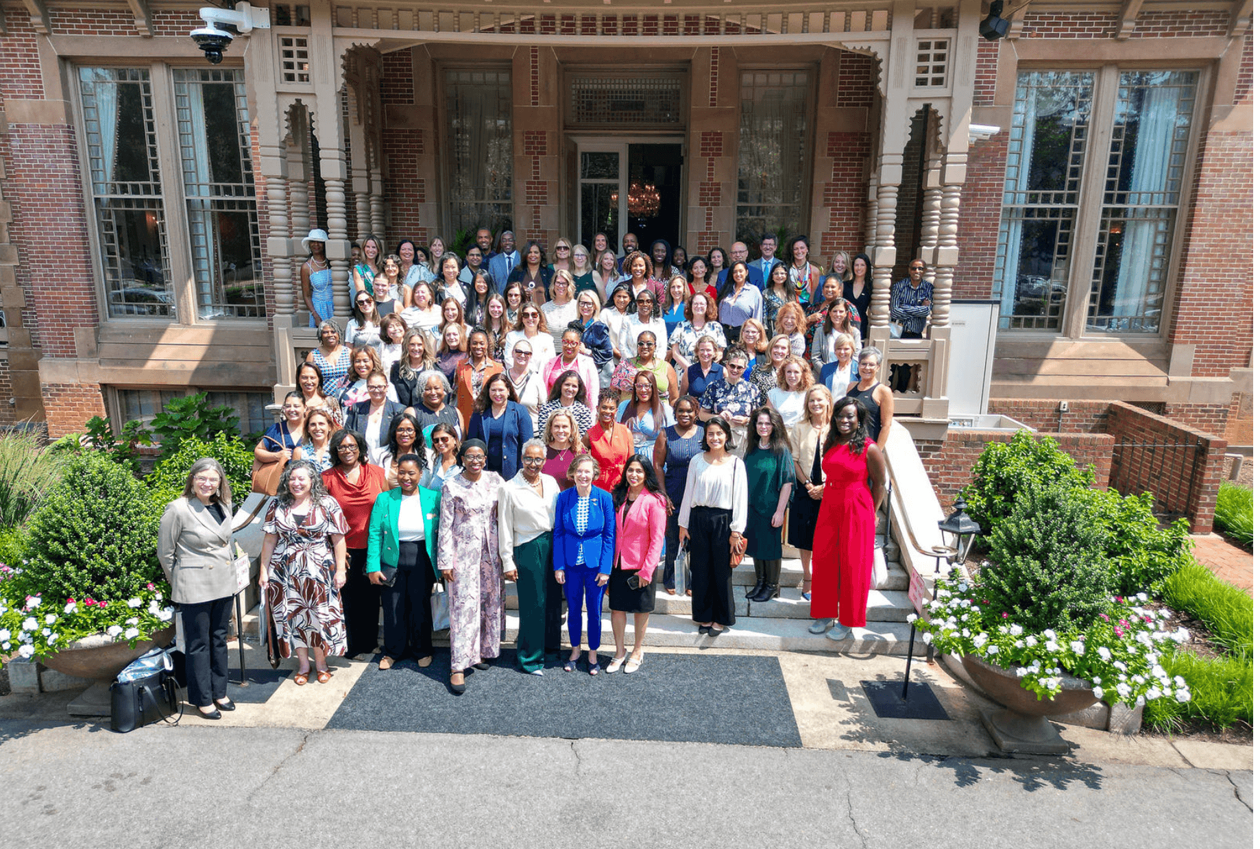 Members of Women Executives Circle gathered on the steps for a group portrait